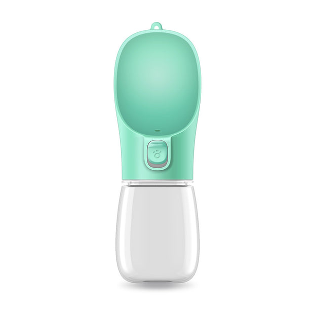 Portable pet water bottle with a green top and clear base on a white background